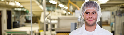 Lebensmitteltechnologe mit Guetzli Lebensmitteltechnologe mit Guetzli